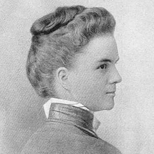 Adella Hunt Logan wearing a high-necked top, looking to the right with her hair up. The photo is in black and white.