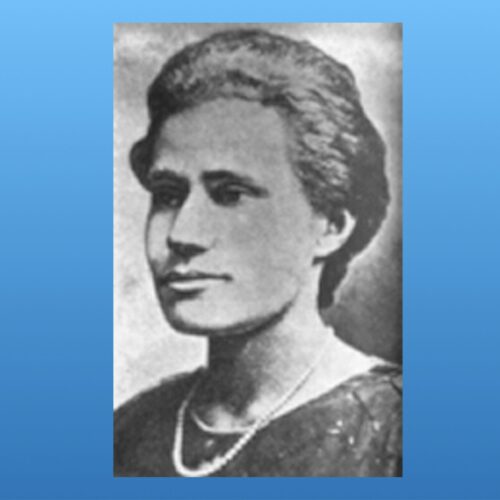 Elizabeth Ross Haynes looking toward her left, wearing short hair, a pearl or beaded necklace, and a dark patterned top. The photo is in black and white.